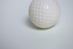 Free Stock Photo: A plastic golf ball isolated on a white background