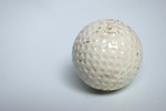 Free Stock Photo: A golf ball isolated on a white background
