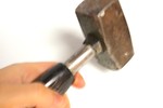 Free Stock Photo: A hand holding a hammer isolated on a white background