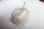 Free Stock Photo: A ball of white plastic string isolated on a white background