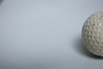 Free Stock Photo: A golf ball isolated on a white background