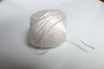 Free Stock Photo: A ball of white plastic string isolated on a white background