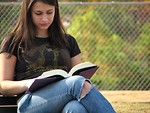 Free Stock Photo: Closeup of teenage girl reading a book