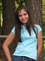 Free Stock Photo: A beautiful latina teen girl posing against a tree