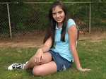 Free Stock Photo: A beautiful latina teen girl posing in the grass