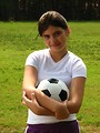 Free Stock Photo: A beautiful teen latina girl posing with a soccer ball