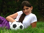 Free Stock Photo: A beautiful teen latina girl posing with a soccer ball