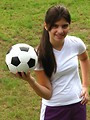 Free Stock Photo: A beautiful teen latina girl posing with a soccer ball
