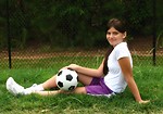Free Stock Photo: A beautiful teen latina girl posing with a soccer ball