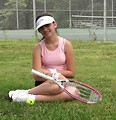 Free Stock Photo: A beautiful teen latina girl posing with tennis gear