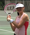 Free Stock Photo: A beautiful teen latina girl posing with tennis gear