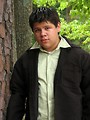 Free Stock Photo: A teen latino boy posing outdoors by a tree