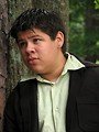 Free Stock Photo: A teen latino boy posing outdoors by a tree