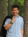 Free Stock Photo: A young latino teen boy posing outdoors by a tree