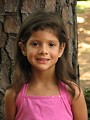 Free Stock Photo: A young latina girl posing outdoors by a tree