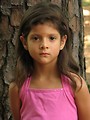 Free Stock Photo: A young latina girl posing outdoors by a tree