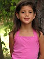 Free Stock Photo: A young latina girl posing outdoors by a tree