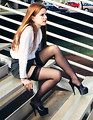 Free Stock Photo: A beautiful girl sitting on steps.