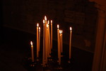 Free Stock Photo: A group of tall white candles burning