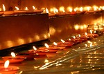 Free Stock Photo: A row of small votive candles burning