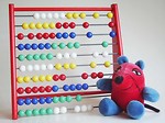 Free Stock Photo: A 100 bit adding machine with a stuffed mouse