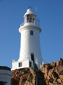 Free Stock Photo: A white lighthouse on rocks