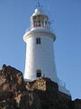 Free Stock Photo: A white lighthouse on rocks