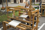 Free Stock Photo: An older woman weaving in the street.