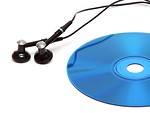 Free Stock Photo: A blue cd with headphones isolated on a white background.