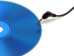 Free Stock Photo: A blue cd with headphones isolated on a white background.