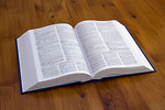 Free Stock Photo: An open book on a wooden table