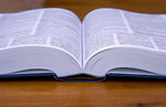 Free Stock Photo: An open book on a wooden table