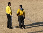 Free Stock Photo: Two soccer referees talking