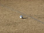 Free Stock Photo: Soccer ball in middle of a field