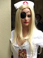 Free Stock Photo: A beautiful girl in a nurse costume with an eye patch at Dragoncon 2009 in Atlanta, Georgia