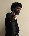 Free Stock Photo: An African American man in a Pulp Fiction costume at Dragoncon 2009 in Atlanta, Georgia