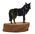 Free Stock Photo: A small wolf statue isolated on a white background