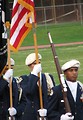 Free Stock Photo: Young soldiers carrying a US flag on a football field