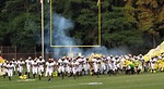 Free Stock Photo: A high school football team chargin onto the field