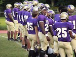 Free Stock Photo: High school football players on lined up on a field