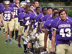 Free Stock Photo: High school football players walking off the field in a line