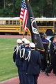 Free Stock Photo: Young soldiers carrying a US flag on a football field