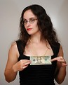 Free Stock Photo: A beautiful business woman holding a twenty dollar bill