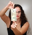 Free Stock Photo: A beautiful business woman holding a twenty dollar bill