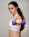 Free Stock Photo: A beautiful young woman exercising with weights