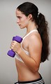 Free Stock Photo: A beautiful young woman exercising with weights