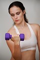 Free Stock Photo: A beautiful young woman exercising with weights