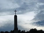 Free Stock Photo: A cross before a cloudy sunset sky