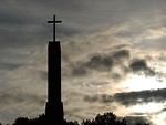 Free Stock Photo: A cross before a cloudy sunset sky