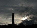 Free Stock Photo: A cross before a cloudy sunset sky
